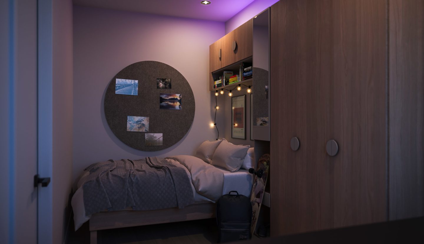 Student apartment bedroom at night
